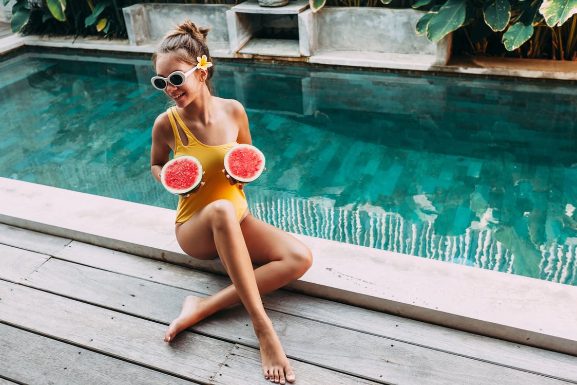 Girl Holding Watermelon by the Pool